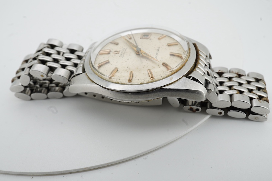 A gentleman's 1964 stainless steel Omega Seamaster Automatic wrist watch, with baton numerals and date aperture, movement 562, case diameter 35mm, on a stainless steel Omega bracelet, with Omega zip up pouch, no papers.